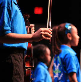 students holding violin
